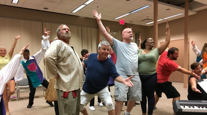 The leads of “Monty Python’s Spamalot” put the big finish on a dance number during rehearsals for the production. Cast members include (from left) Dan Carey, Dan Hunt, Troy Berry, Tia Seay, Ryan McCarty and Brice Thomas. CONTRIBUTED