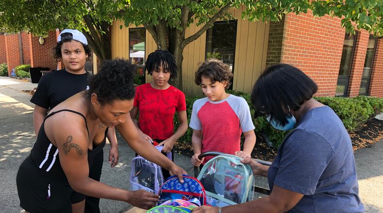 Free back to school items including backpacks, water bottles and hygiene items were a big part of events at Springfield’s Church of Jesus Family Worship Center on Saturday afternoon. More than 350 backpacks and 50 water bottles were given away. Brett Turner/CONTRIBUTED