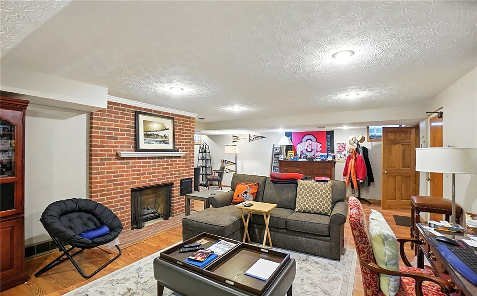 The finished basement has a recreation room with gas brick fireplace and recessed lighting. CONTRIBUTED