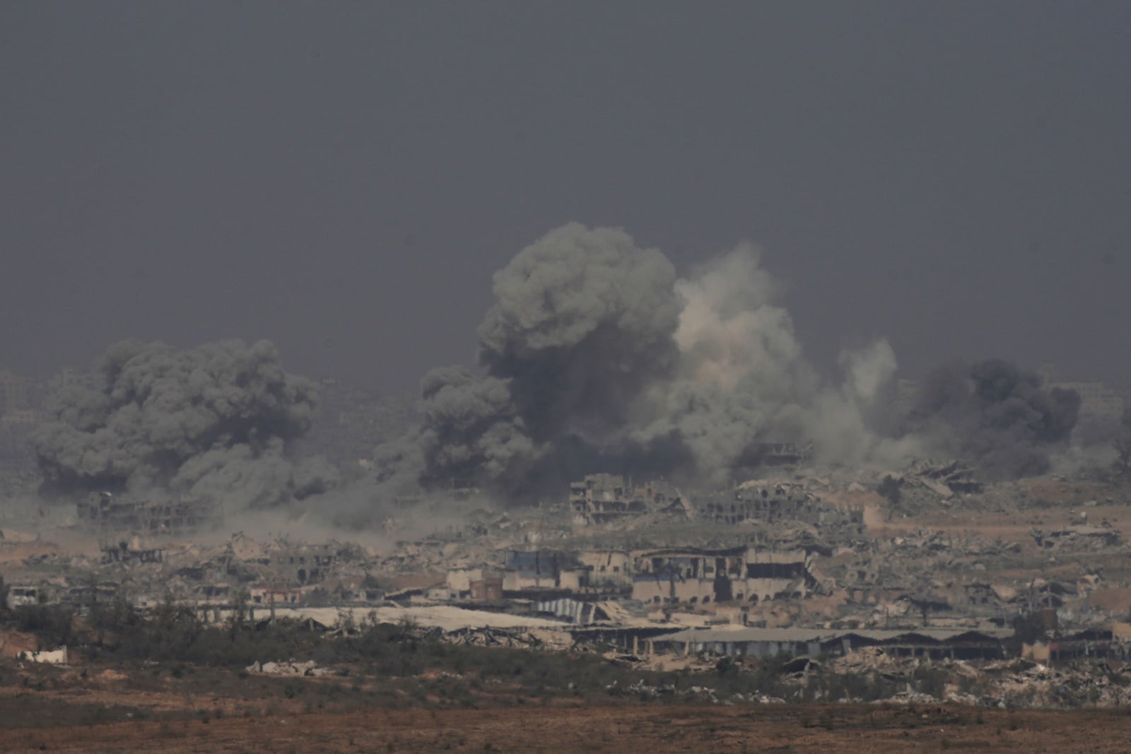 Smoke rises from an explosion in the northern Gaza Strip, as seen from southern Israel Sunday, July 27, 2025. (AP Photo/Ohad Zwigenberg)