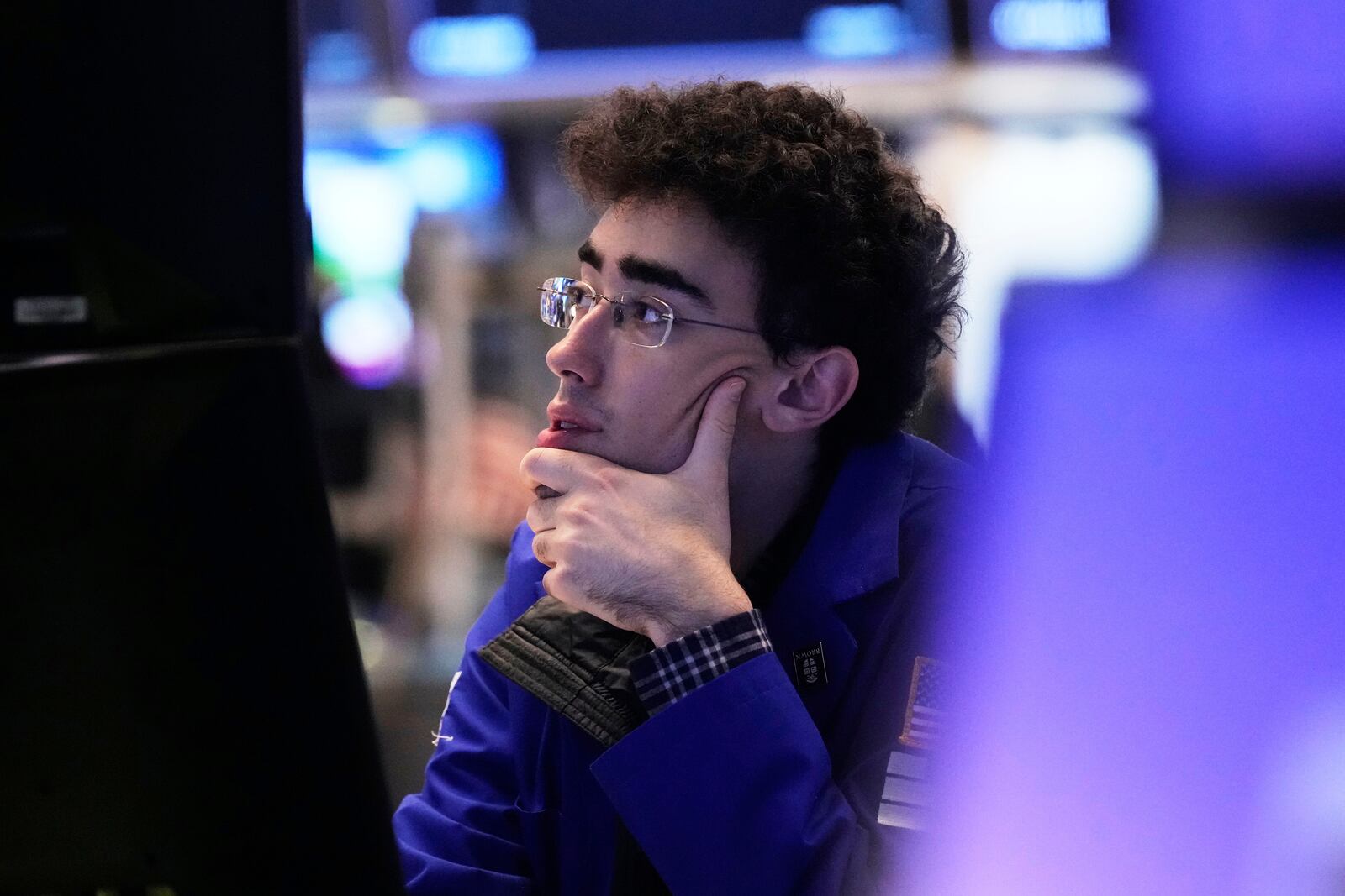 Specialist Alexander Weitzman works on the floor of the New York Stock Exchange, Tuesday, April 15, 2025. (AP Photo/Richard Drew)