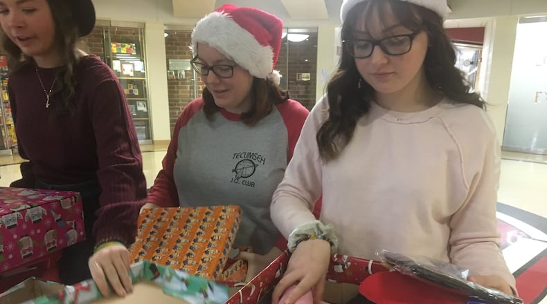 Tecumseh s Junior Optimist Club collected headphones, hygiene products, clothes and other gifts for Helping Hands of Dayton Homeless Shelter.