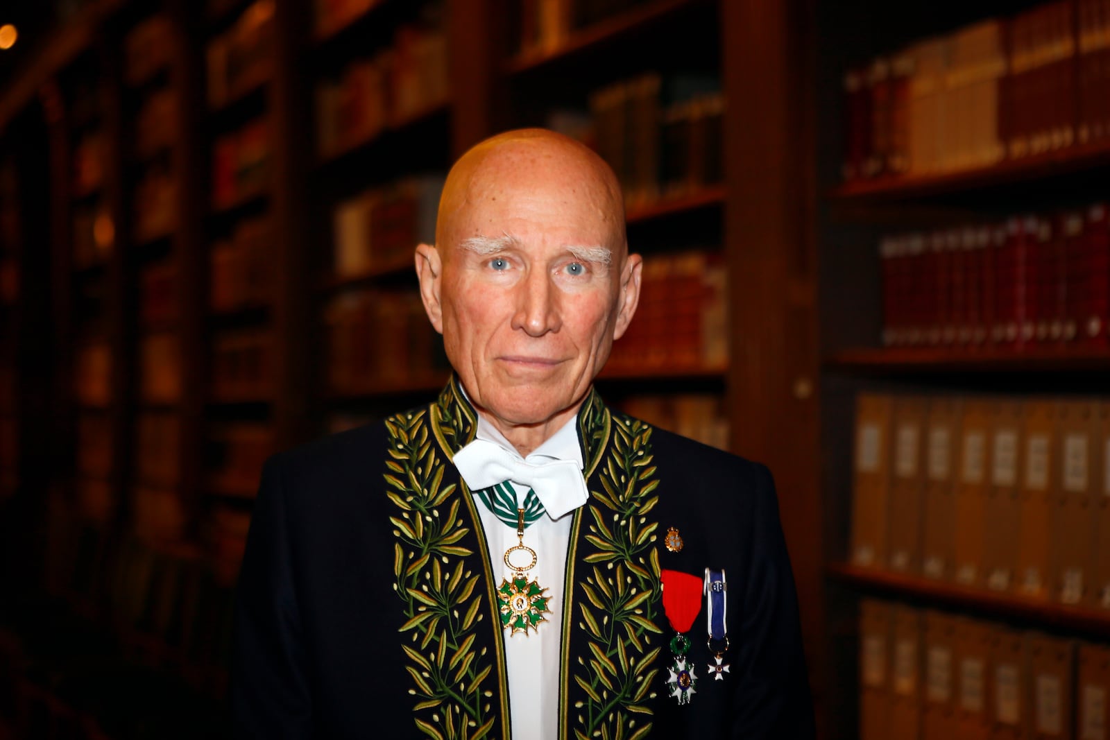 FILE - Photographer Sebastiao Salgado poses for a photo after his election to the French Academy of Fine Arts during a ceremony in Paris, Dec. 6, 2017. Salgado, known for his long-term projects and images of nature and humanity, died at age 81, the Instituto Terra confirmed on Friday, May 23, 2025. (AP Photo/Francois Mori, File)