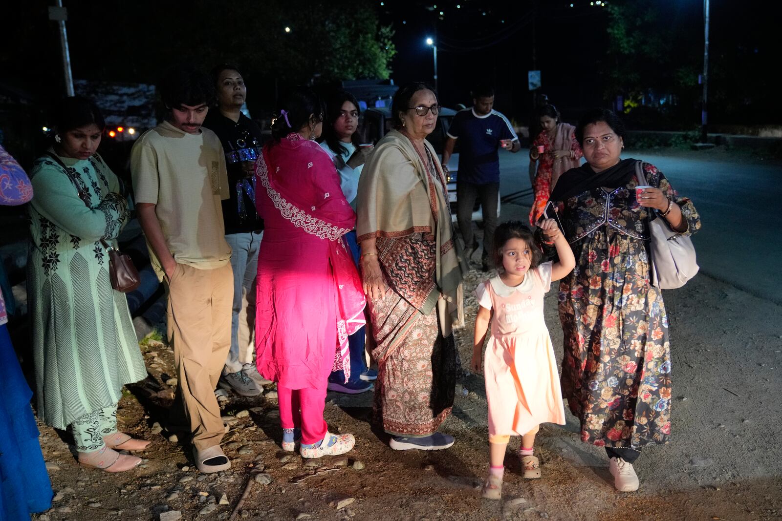 Indian tourists who were stuck on the road heading to Pahalgam leave after police ordered them to vacate the area, following an incident where assailants indiscriminately opened fire on tourists visiting Pahalgam in Indian controlled Kashmir, Tuesday, April 22, 2025.(AP Photo/Dar Yasin)