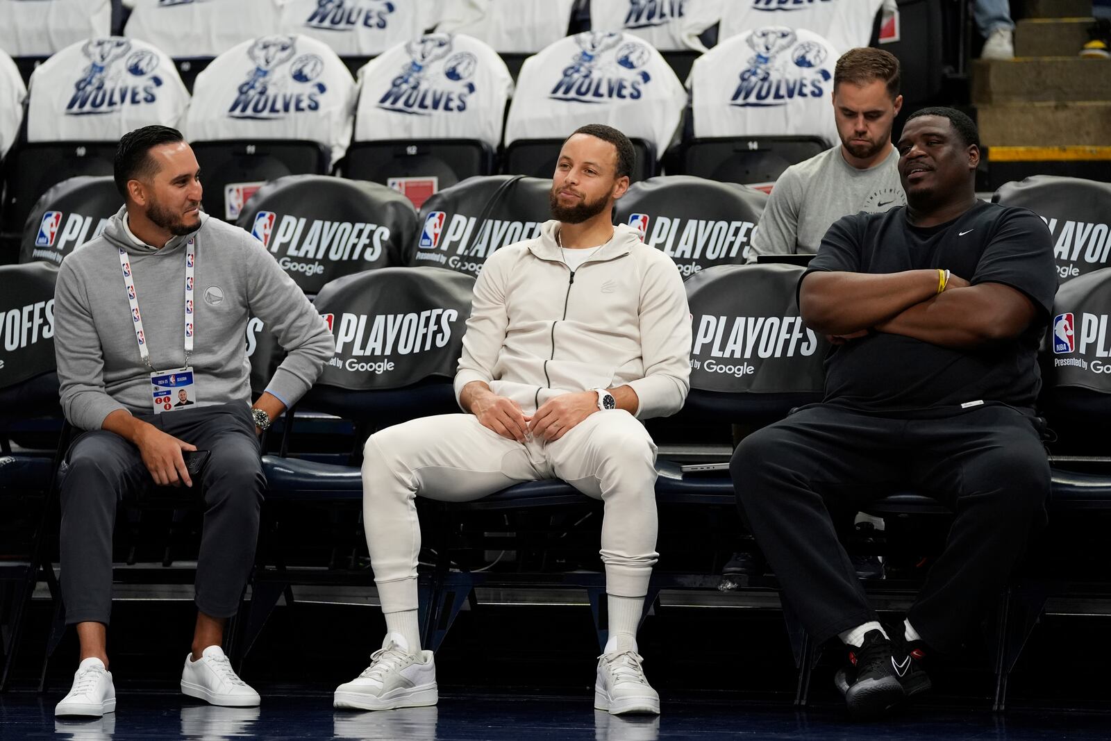 Golden State Warriors guard Stephen Curry, middle, sits before Game 5 of an NBA basketball second-round playoff series against the Minnesota Timberwolves, Wednesday, May 14, 2025, in Minneapolis. (AP Photo/Abbie Parr)