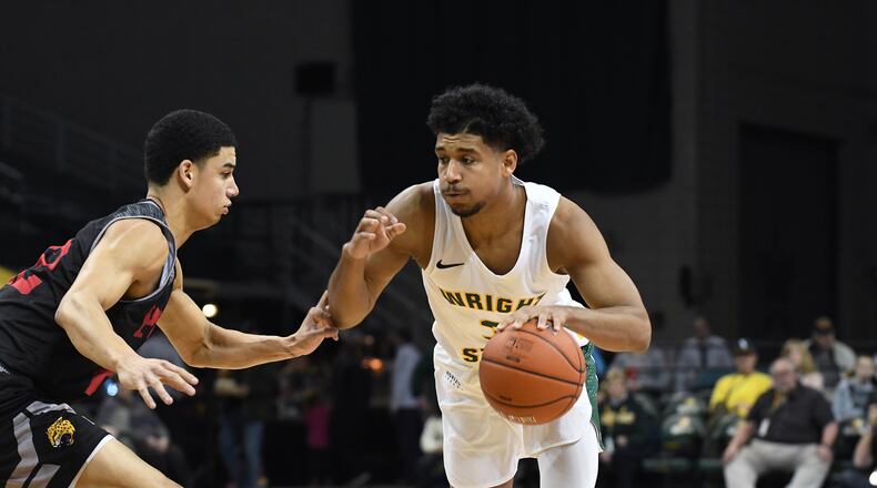 Wright State’s Mark Hughes drives against a IUPUI defender on Sunday, Dec. 30, 2018, at the Nutter Center. Keith Cole/CONTRIBUTED