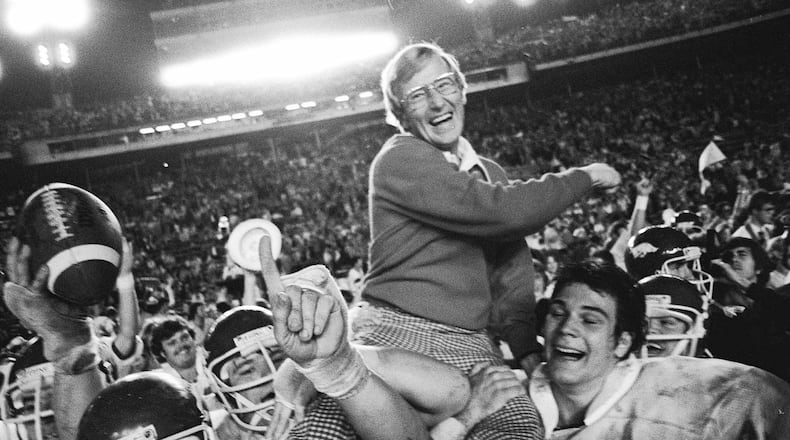 FILE - Arkansas coach Lou Holtz is carried by his players after defeating Oklahoma in the Orange Bowl NCAA college football game, Jan. 2, 1978, in Miami, Fla. (AP Photo/Phil Sandlin, File)