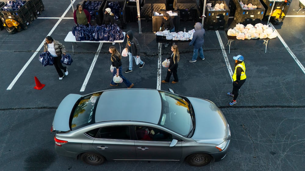MUST Ministries delivers food to the public via a drive through service, Saturday, Nov. 1, 2025, in Austell, Ga. (AP Photo/Mike Stewart)
