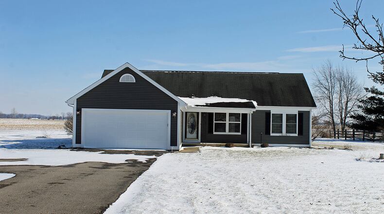 This 3-bedroom, updated ranch with about 1,350 sq. ft. of living space sits on .76 acres. It has an attached, 2-car garage and rear patio. CONTRIBUTED PHOTO BY VICKIE KAPNAS
