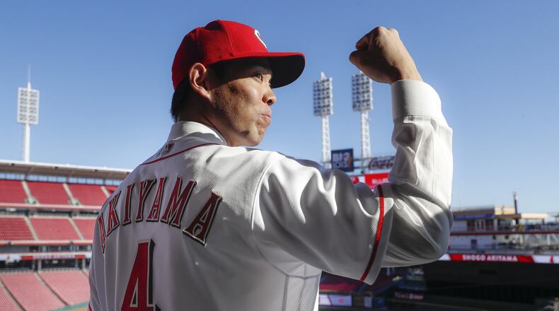 Cincinnati Reds outfielder Shogo Akiyama stands for photographs at Great American Ballpark after a news conference, Wednesday, Jan. 8, 2020, in Cincinnati. Outfielder Shogo Akiyama agreed to a $21 million, three-year deal with the Cincinnati Reds, the only major league baseball team that hasn’t had a player born in Japan. The 31-year-old center fielder was a five-time All-Star during his nine seasons with the Seibu Lions in Japan’s Pacific League. (AP Photo/John Minchillo)