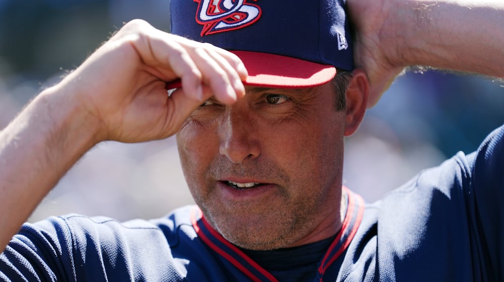 United States manager Mark DeRosa adjusts his baseball cap prior to an exhibition baseball game against the Colorado Rockies Wednesday, March 4, 2026, in Scottsdale, Ariz. (AP Photo/Ross D. Franklin)