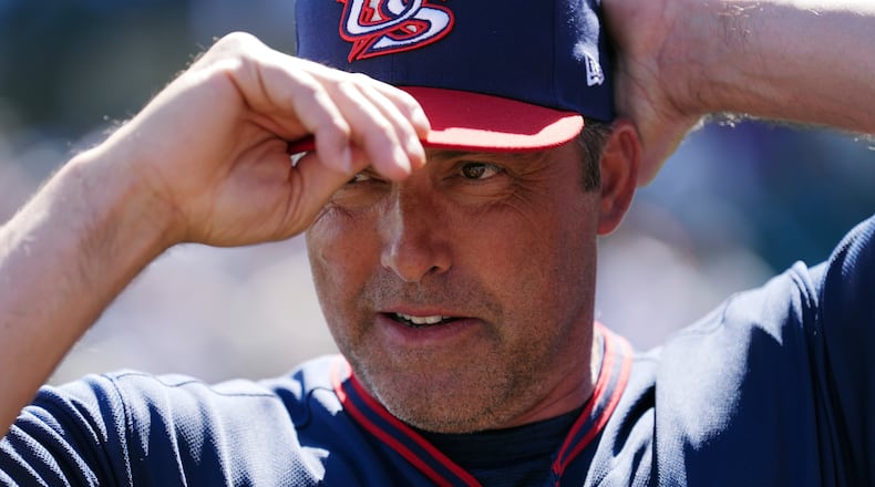 United States manager Mark DeRosa adjusts his baseball cap prior to an exhibition baseball game against the Colorado Rockies Wednesday, March 4, 2026, in Scottsdale, Ariz. (AP Photo/Ross D. Franklin)