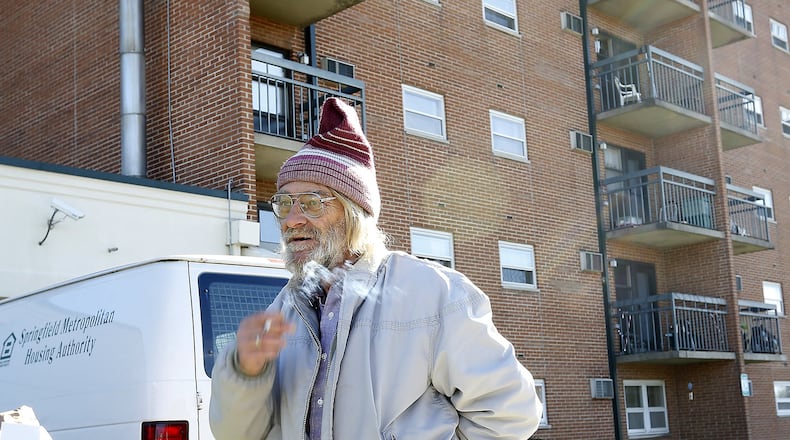 David Kohler, a resident a Hugh Taylor Apartments, smokes a cigarette as he talks about the proposed ban on smoking in public housing in November of 2015. Bill Lackey/Staff