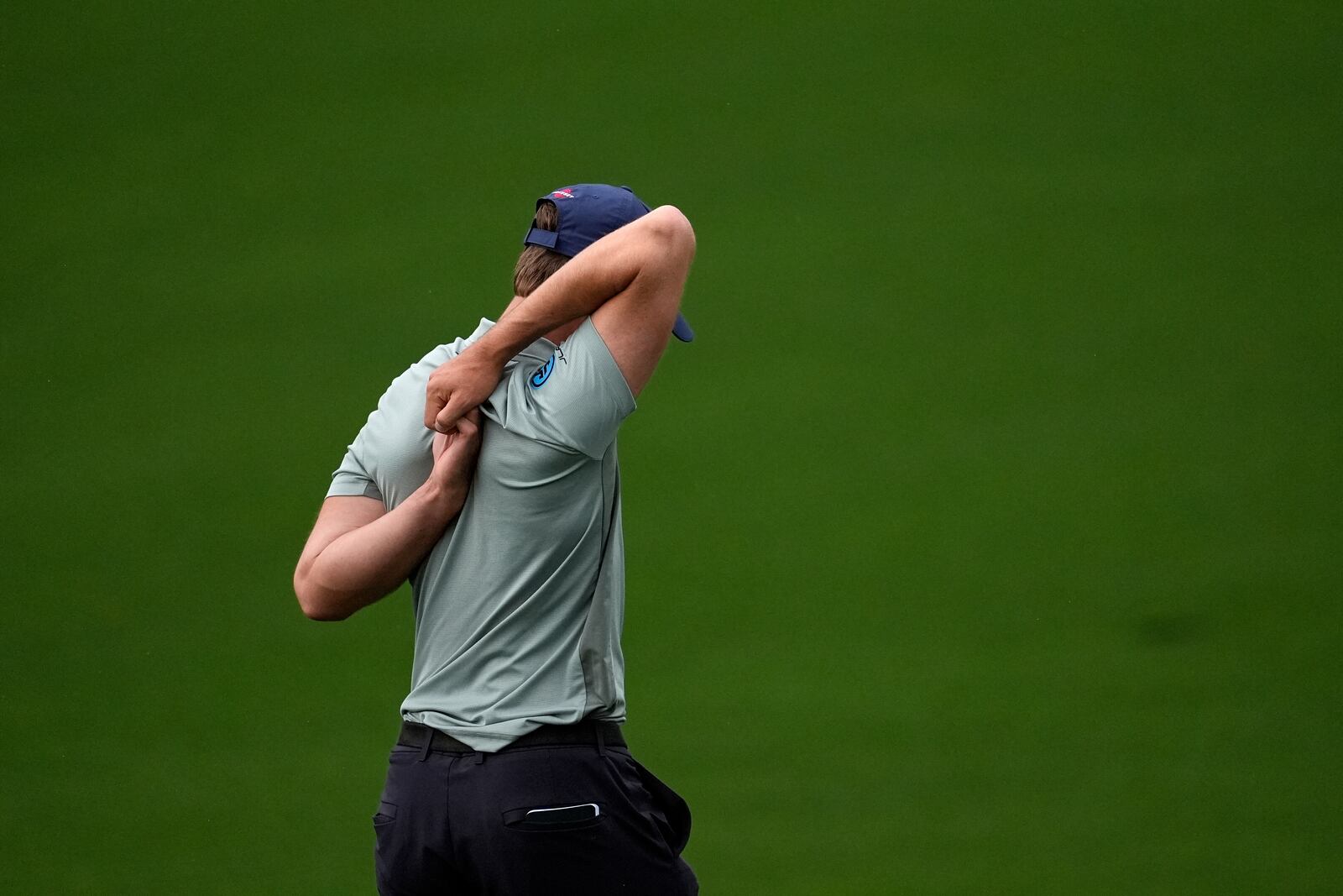 Thomas Detry, of Belgium, stretches during a practice around at the Masters golf tournament, Monday, April 7, 2025, in Augusta, Ga. (AP Photo/George Walker IV)