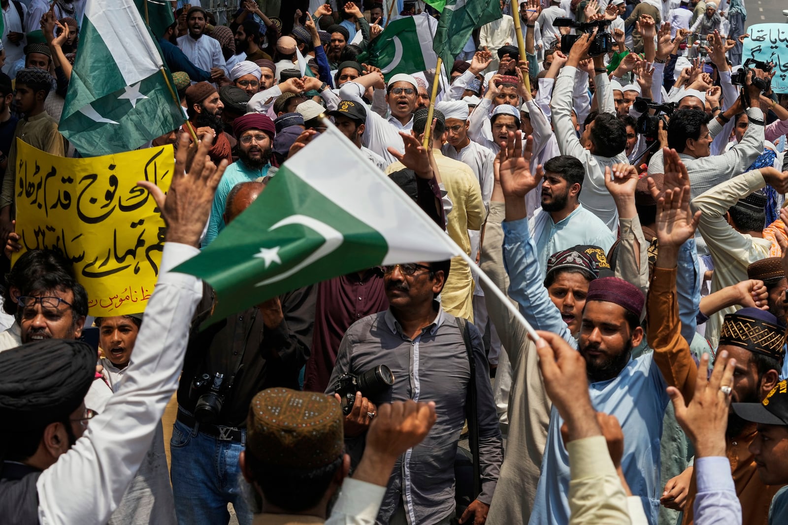 Supporters of a religious group 'Tahafuz-e-Namoos-e-Risalat Mahaz' take part in a rally to condemn Indian strikes in Pakistan and to show their support with Pakistan Army, in Lahore, Pakistan, Saturday, May 10, 2025. (AP Photo/K.M. Chaudary)