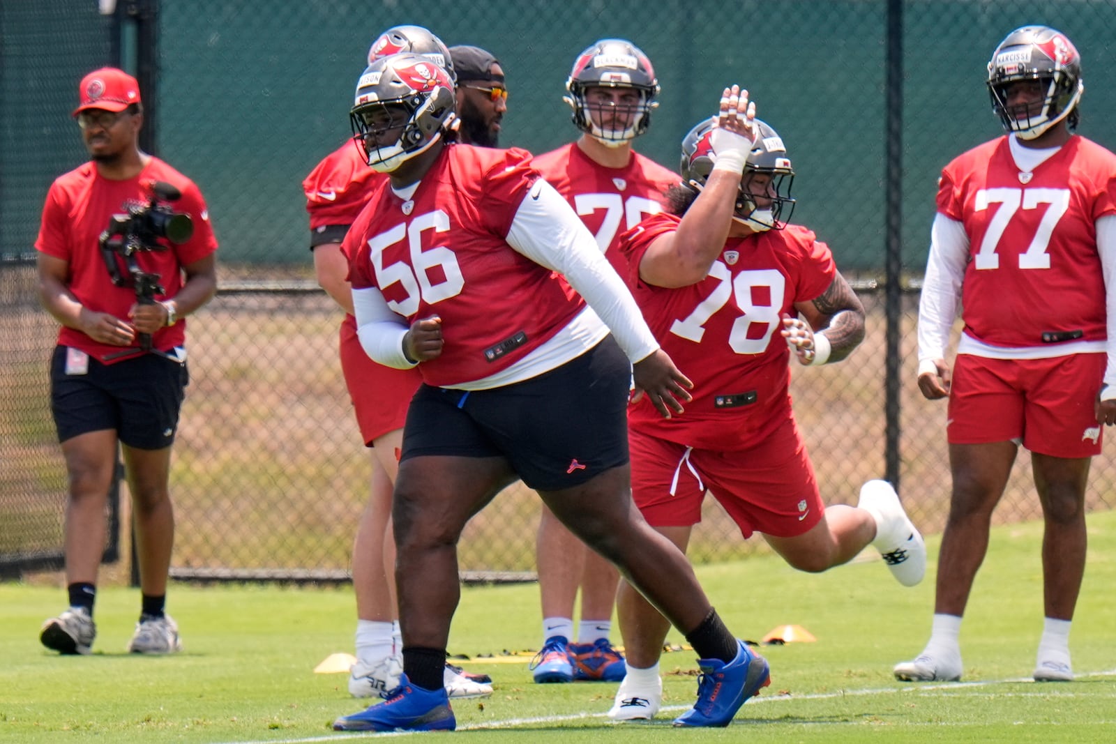 Tampa Bay Buccaneers nose tackle Desmond Watson (56) works against Dvon J-Thomas (78) during the NFL football team's rookie minicamp Friday, May 9, 2025, in Tampa, Fla. (AP Photo/Chris O'Meara)