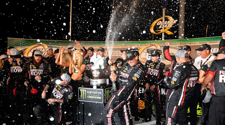 SPARTA, KENTUCKY - JULY 08: Martin Truex Jr., driver of the #78 Furniture Row/Denver Mattress Toyota, celebrates with his crew in Victory Lane after winning the Monster Energy NASCAR Cup Series Quaker State 400 presented by Advance Auto Parts at Kentucky Speedway on July 8, 2017 in Sparta, Kentucky. (Photo by Robert Laberge/Getty Images)