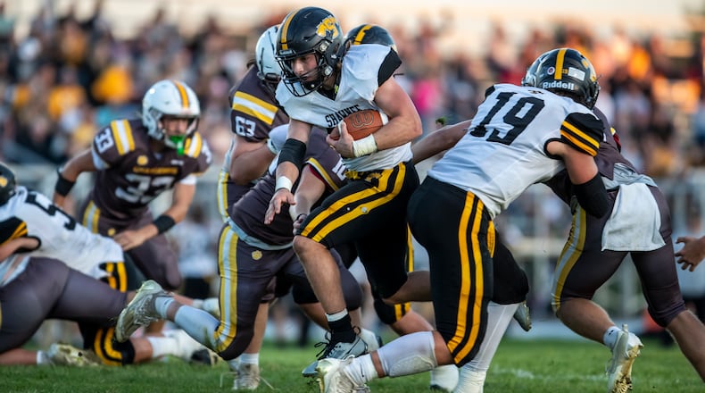 Shawnee High School senior TJ Meeks runs the ball across the goal line during their game against Kenton Ridge on Friday night in Springfield. The Braves won 30-0. CONTRIBUTED PHOTO BY MICHAEL COOPER