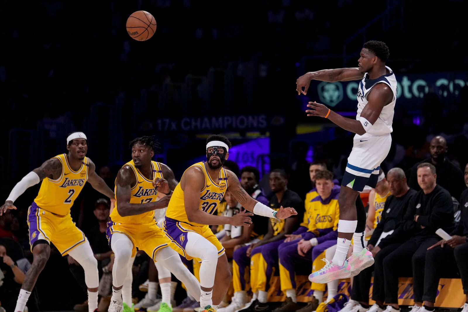 Minnesota Timberwolves guard Anthony Edwards (5) passes during the first half of Game 2 of an NBA first-round playoff series against the Los Angeles Lakers in Los Angeles, Tuesday, April 22, 2025. (AP Photo/Eric Thayer)