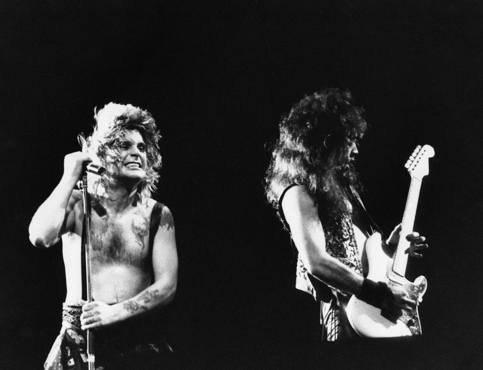 FILE - Ozzy Osbourne, left, performs, Jan. 17, 1985, at the Rock in Rio music festival in Rio de Janeiro, Brazil. (AP Photo, File)
