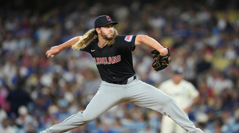 Cleveland Guardians relief pitcher Scott Barlow throws during the third inning of a baseball game against the Los Angeles Dodgers in Los Angeles, Saturday, Sept. 7, 2024. (AP Photo/Ashley Landis)