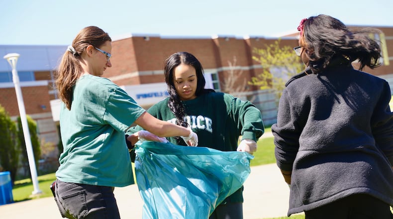 Students in the Springfield City School District observed Earth Day this week, including the High School National Honor Society picking up liter around the campus. Contributed
