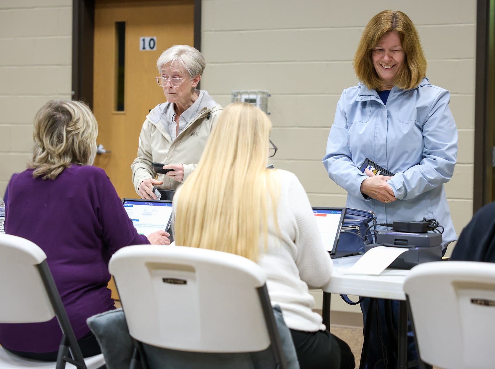 Voters at a polling location at New Season Ministry in Huber Heights check in on Tuesday, May 6. BRYANT BILLING / STAFF