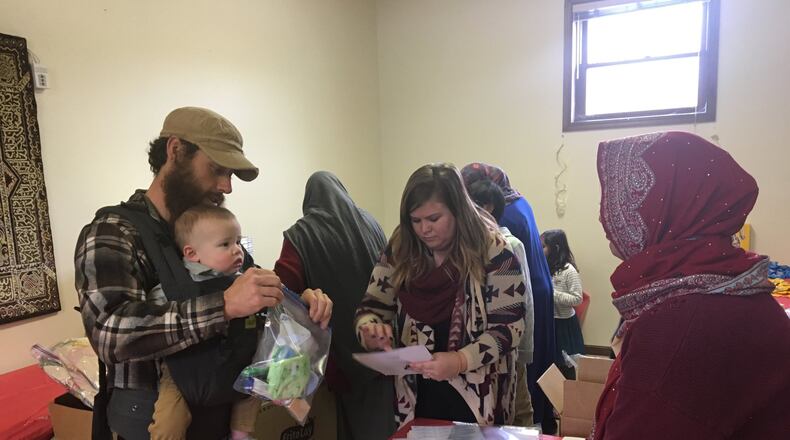 Around 100 members of the Miami Valley Islamic Association and Champion City Vineyard Church met at the Masjid Al-Madina Mosque on Sunday, Dec. 10 to pack numerous items to be donated to the Springfield Soup Kitchen. BRETT TURNER/CONTRIBUTED
