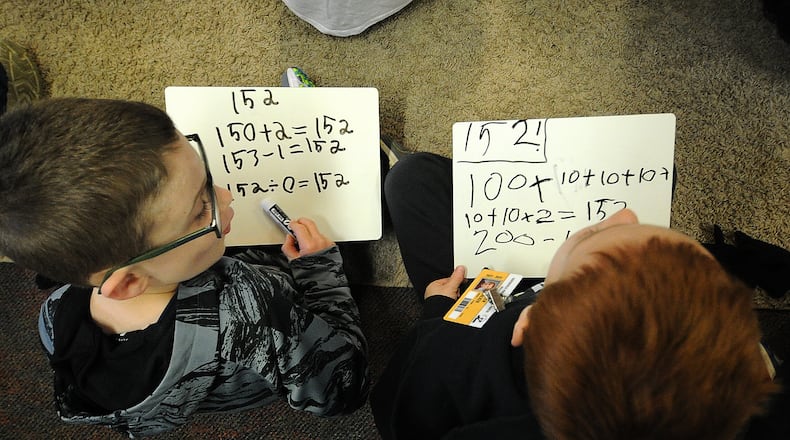 First-grade students in Sarah Jacobs math class work on addition and subtraction skills Monday, April 22, 2024 at the Primary Village North school in Centerville. A proposed bill would allow military families to enroll in almost any Ohio public school. MARSHALL GORBY\STAFF