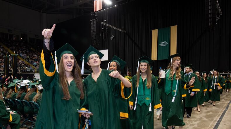 Wright State University graduated 1,603 students in April. Students received their diploma presentation folder during the ceremonies at the Nutter Center. CONTRIBUTED/WRIGHT STATE