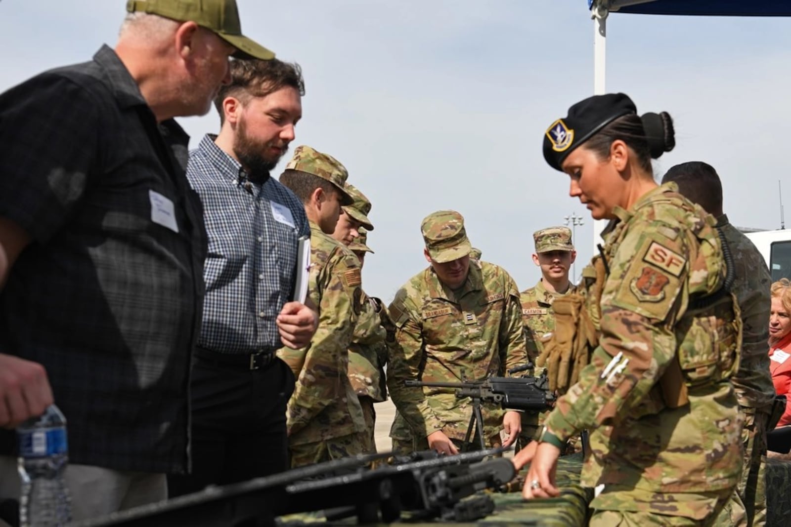 A Security Forces Airmen assigned to the Ohio Air National Guard’s 178th Wing engages with citizens during the wing's Community Day in April 2023 in Springfield. (U.S. Air National Guard photo by Senior Airman Jill Maynus)
