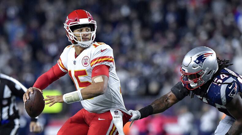 Kansas City Chiefs quarterback Patrick Mahomes throws an interception in the end zone under pressure from New England Patriots linebacker Dont’a Hightower in the closing seconds of the second quarter on Sunday, Oct. 14, 2018 at Gillette Stadium in Foxborough, Mass. (John Sleezer/Kansas City Star/TNS)