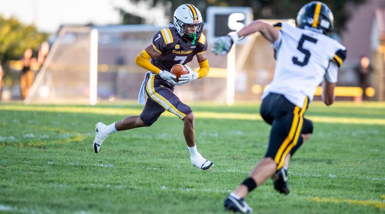 Kenton Ridge High School sophomore Caleb Gutierrez sprints toward Shawnee's Logan Collier during their game earlier this season in Springfield. CONTRIBUTED PHOTO BY MICHAEL COOPER