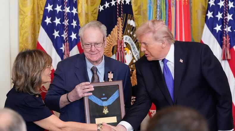 President Donald Trump posthumously presents the Medal Honor to Robert and Linda Ollis, parents of Staff Sergeant Michael Ollis, during a ceremony in the East Room of the White House, Monday, March 2, 2026, in Washington. (AP Photo/Alex Brandon)