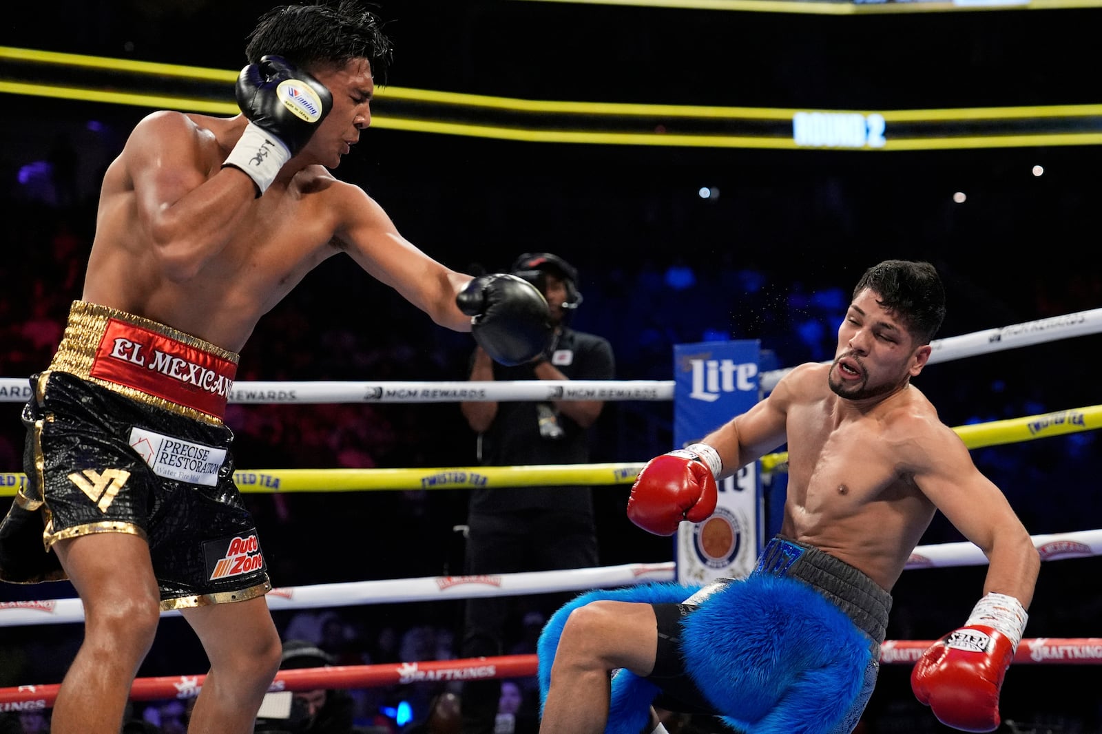 Emiliano Fernando Vargas knocks down Juan Leon in a junior welterweight boxing match Sunday, May 4, 2025, in Las Vegas. (AP Photo/John Locher)