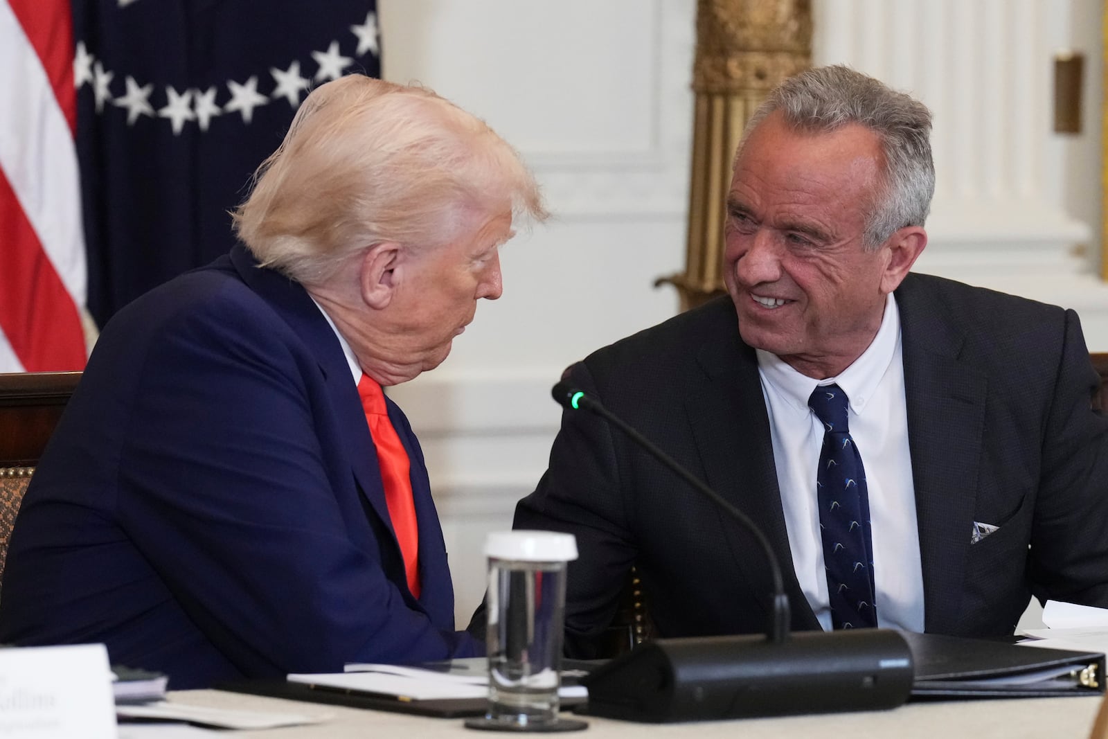 President Donald Trump, left, and Health and Human Services Secretary Robert F. Kennedy Jr. attend a Make America Healthy Again (MAHA) Commission Event in the East Room of the White House, Thursday, May 22, 2025, in Washington. (AP Photo/Jacquelyn Martin)