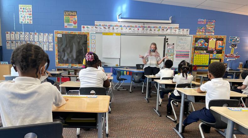 A Fairview Elementary teacher welcomes students back to school and reviews COVID-19 protocols with them before beginning class on Monday, March 1st.