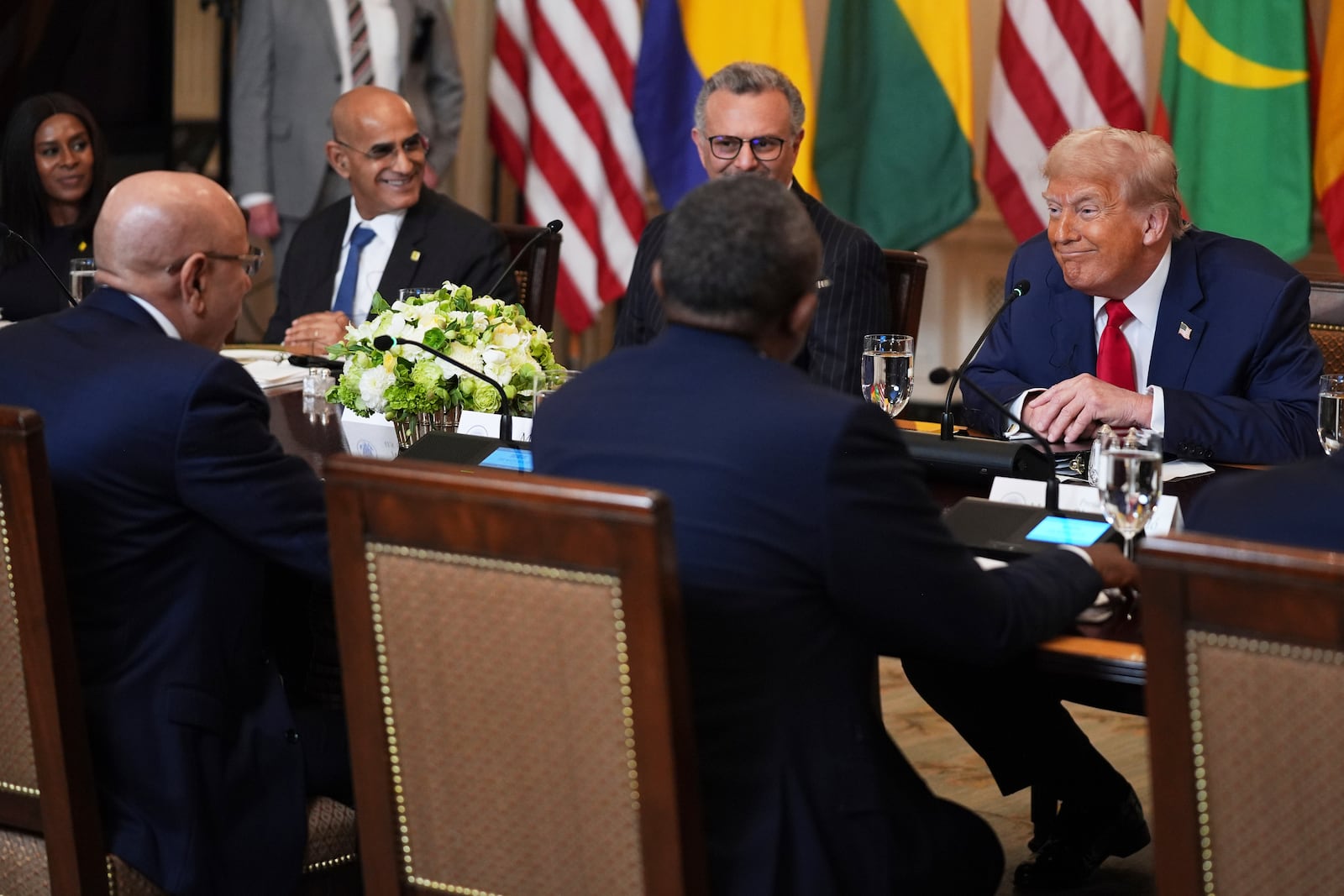 President Donald Trump speaks with African leaders including Senegalese President Bassirou Diomaye Faye, Liberian President Joseph Nyuma Boakai, Bissau-Guinean President Umaro Sissoco EmbalÛ, Mauritanian President Mohamed Ould Ghazouani and Gabonese President Brice Oligui Nguema during a lunch in the State Dining Room of the White House, Wednesday, July 9, 2025, in Washington. (AP Photo/Evan Vucci)