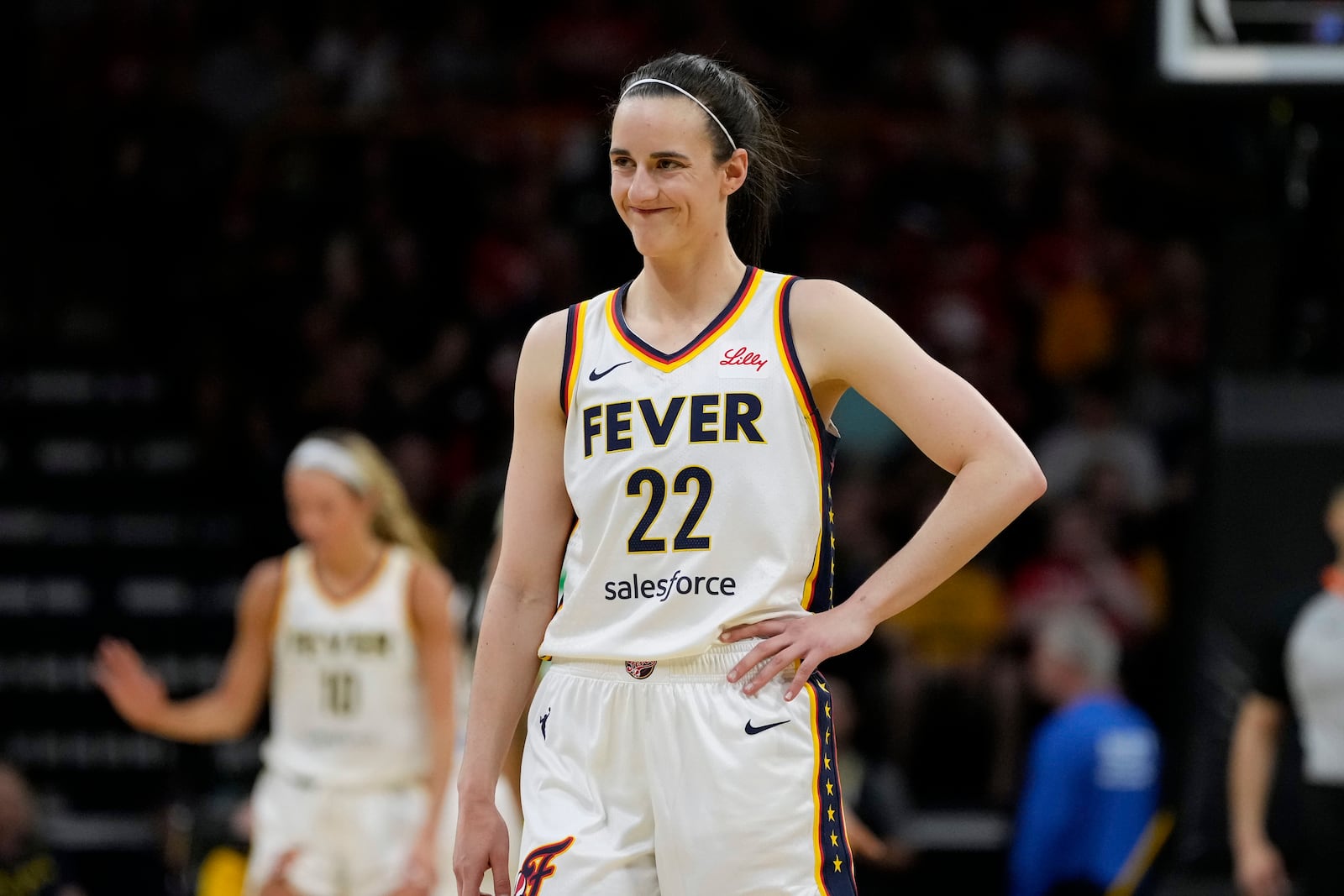 Indiana Fever guard Caitlin Clark reacts to a fan during the first half of an exhibition women's basketball game against Brazil, Sunday, May 4, 2025, in Iowa City, Iowa. (AP Photo/Charlie Neibergall)
