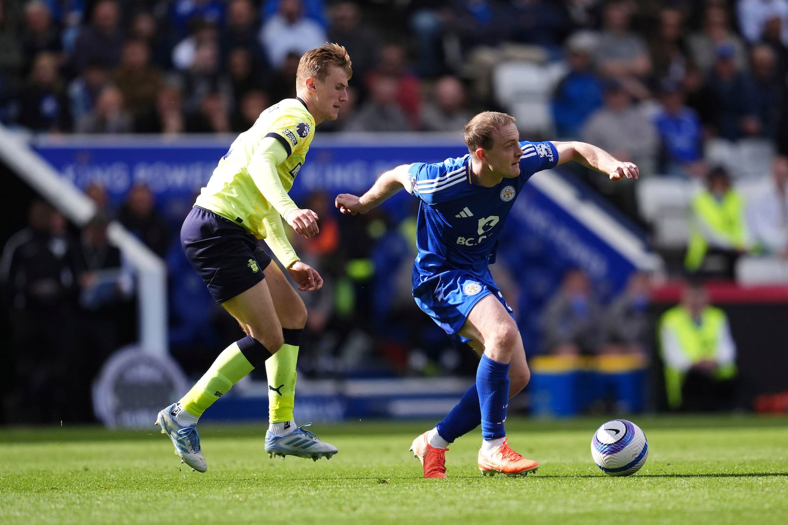 Southampton's Flynn Downes, left, and Leicester City's Oliver Skipp in action during the English Premier League soccer match between Leicester City and Southampton at the King Power Stadium, Leicester, England, Saturday May 3, 2025. (Adam Davy/PA via AP)