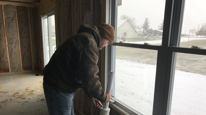 Clark County building inspector, Jerry Downs, finishes up an inspection at a home on Saddlebrook Run in North Hampton. Katherine Collins/Staff