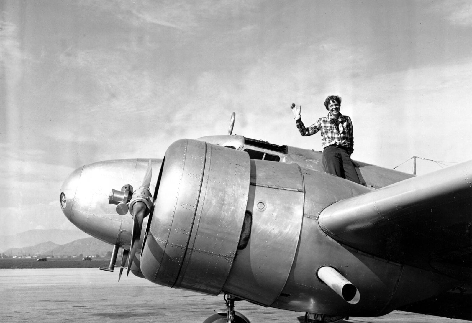 American aviatrix Amelia Earhart waves from the Electra before taking off from Los Angeles on March 10, 1937. Earhart was flying to Oakland, California, where she and her crew would begin their round-the-world flight to Howland Island on March 18.AP File Photo