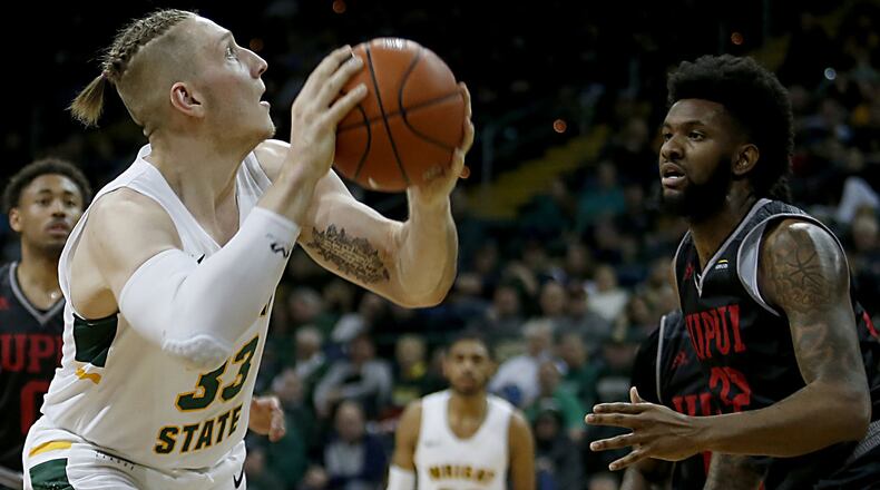 Wright State University center Loudon Love looks to shoot against IUPUI forward Elyjah Goss during their Horizon League game at the Nutter Center in Fairborn Sunday, Feb. 16, 2020. Wright State won 106-66. Contributed photo by E.L. Hubbard