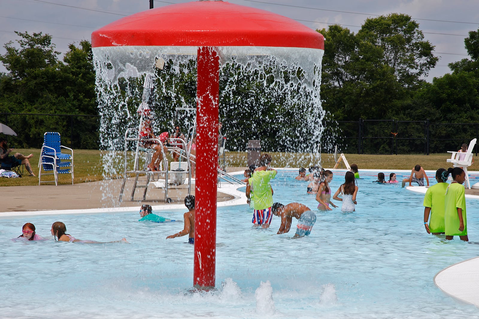 A swimmer cool off in the water at Splash Zone water park Tuesday, June 18, 2024. BILL LACKEY/STAFF