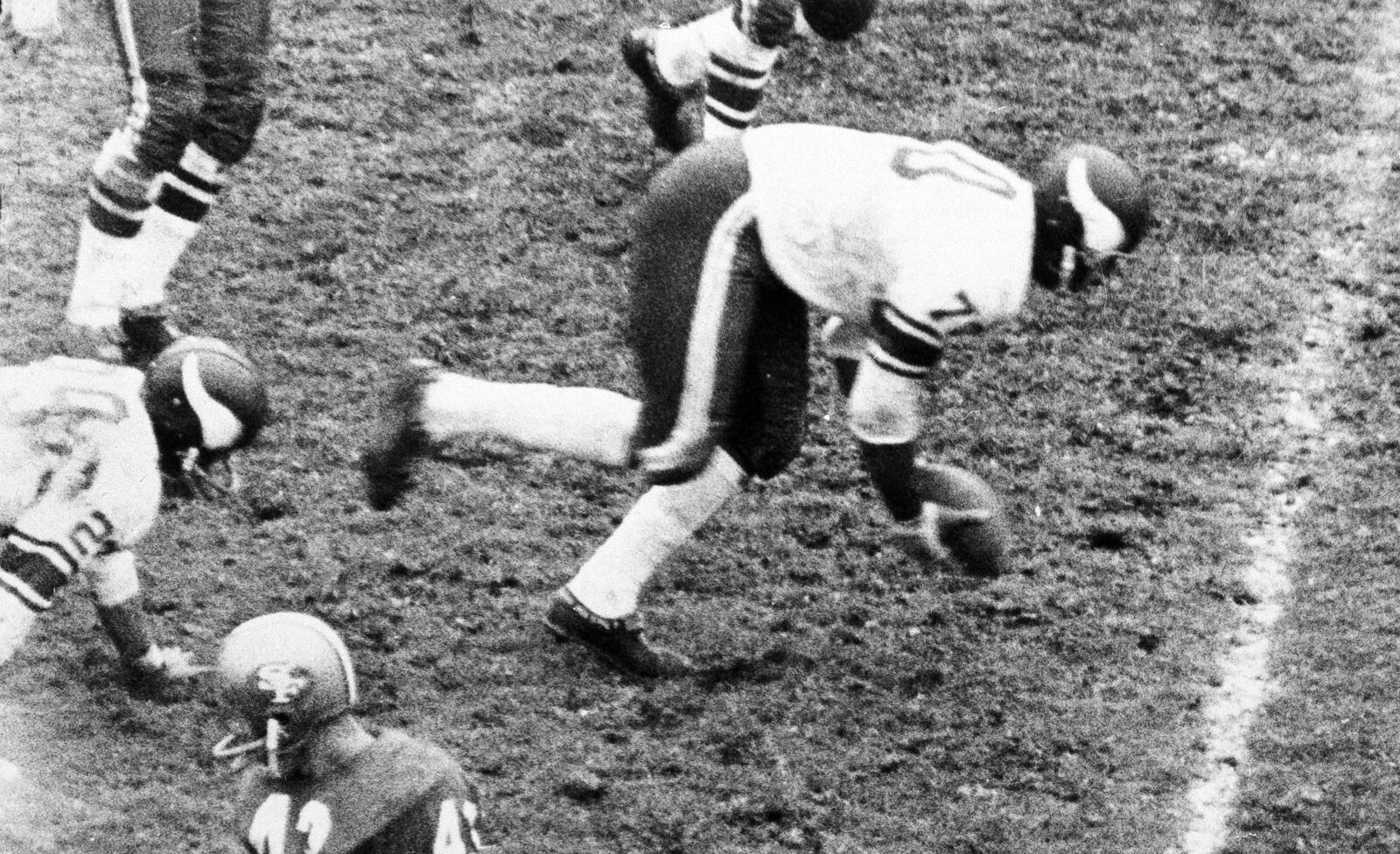 FILE - Minnesota Vikings defensive end Jim Marshall (70) scoops up a fumble by the San Francisco 49ers and starts running 60-yards the wrong way run into his own end zone for a safety during the fourth quarter of an NFL football game in San Francisco, Calif., Oct. 26, 1964. (San Francisco Examiner via AP, file)
