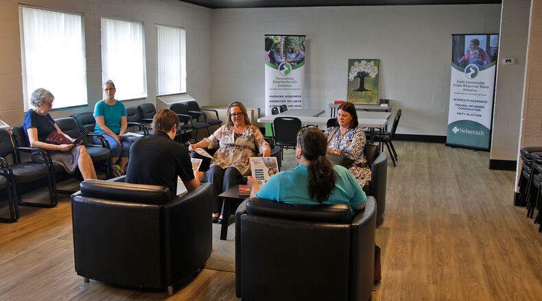 The Nehemiah Foundation's Amy Wilmann, center, talks about the foundation's new location in The Metropolis Friday, June 21, 2024 during a tour of their new facilities. BILL LACKEY/STAFF