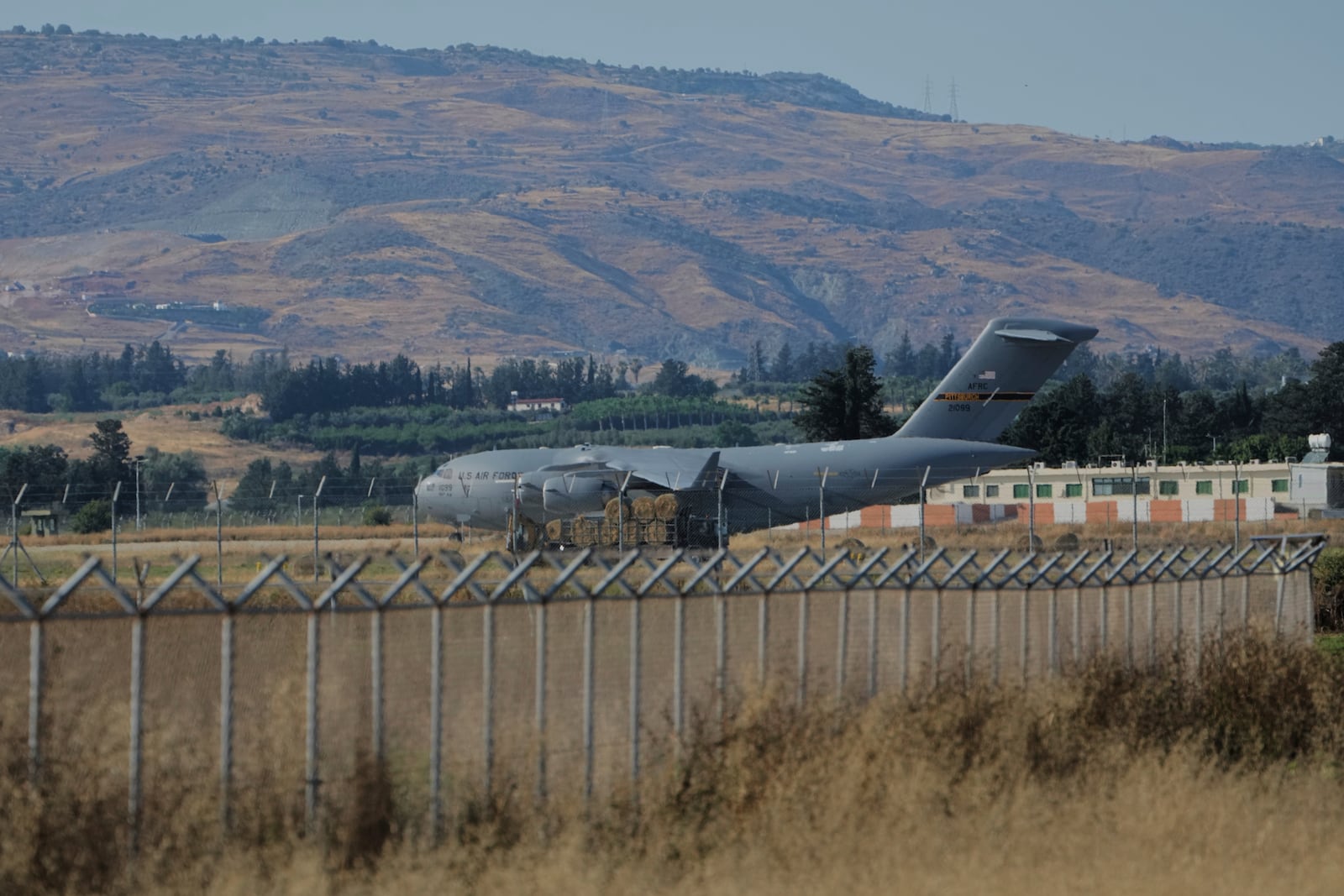 A US Air Force C-17 Globemaster transport aircraft sits on the tarmac of Andreas Papandreou Air Force Base in Paphos, Cyprus, Wednesday, June 18, 2025. (AP Photo/Petros Karadjias)