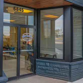 Josh Blake does construction on the upcoming Nifty Thrifties Bargain Bins on Friday, October 31, 2025, in Enon. The store is planned to open in November. JOSEPH COOKE/STAFF
