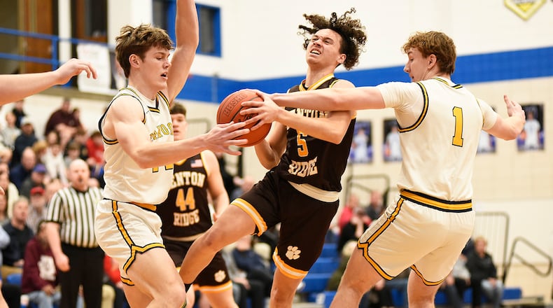 Kenton Ridge senior Xavier White attempts to split the defense during their Division IV second round game against Oakwood on Saturday, Feb. 28, 2026 at Xenia High School. The Lumberjacks won 75-68. GEOFF NEVILLE / CONTRIBUTED PHOTO