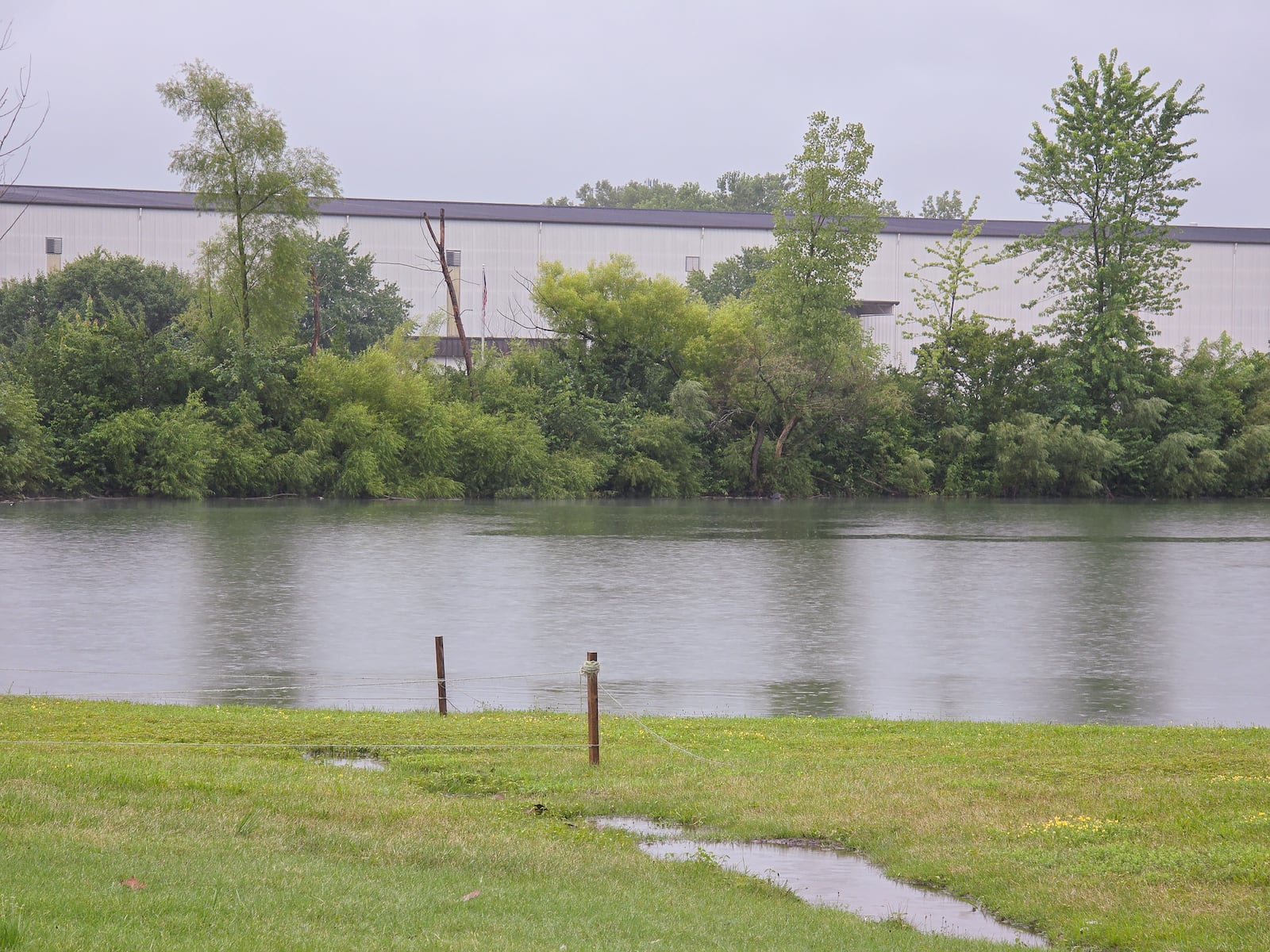A water-chemical mix of 1,400 gallons leaked into a drainage ditch that flows into a retention pond late on Wednesday, July 30 at Parker Trutec in PrimeOhio Corporate Park near state Route 41 in Springfield. BRYANT BILLING / STAFF